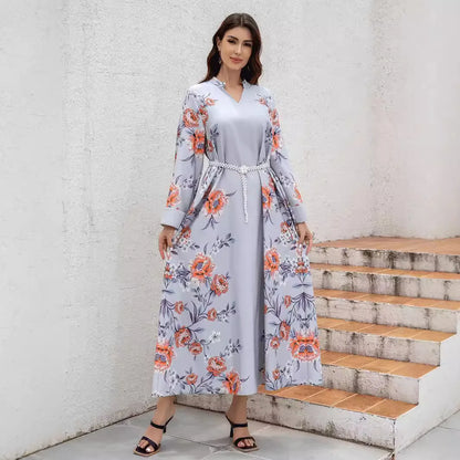 Middle Eastern and Turkish fashionable printed Muslim women's abaya with a waistband. It is a casual V-neck dress from Dubai.